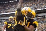 PITTSBURGH - DECEMBER 27:  Santonio Holmes #10 of the Pittsburgh Steelers celebrates a second quarter touchdown with Mike Wallace #17 while playing the Baltimore Ravens on December 27, 2009 at Heinz Field in Pittsburgh, Pennsylvania.  (Photo by Gregory Shamus/Getty Images)