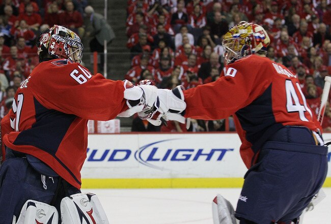 WASHINGTON - APRIL 17: Semyon Varlamov #40 (R) of the Washington Capitals takes over goaltender duties from Jose Theodore #60 (L) in the first period of their game against the Montreal Canadiens in Game Two of the Eastern Conference Quarterfinals during the 2010 NHL Stanley Cup Playoffs at the Verizon Center on April 17, 2010 in Washington, DC.  (Photo by Bruce Bennett/Getty Images)