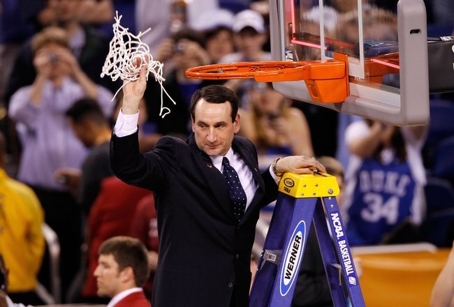 INDIANAPOLIS - APRIL 05:  Head coach Mike Krzyzewski of the Duke Blue Devils celebrates after he cut down a piece of the net following their 61-59 win against the Butler Bulldogs during the 2010 NCAA Division I Men's Basketball National Championship game at Lucas Oil Stadium on April 5, 2010 in Indianapolis, Indiana.  (Photo by Kevin C. Cox/Getty Images)