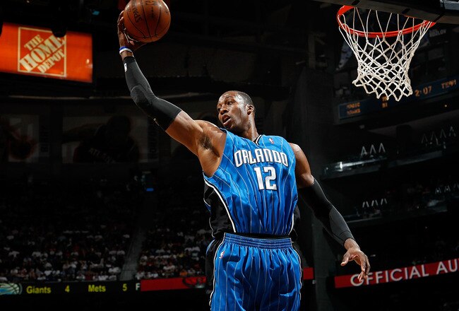 ATLANTA - MAY 08:  Dwight Howard #12 of the Orlando Magic grabs a rebound against the Atlanta Hawks during Game Three of the Eastern Conference Semifinals during the 2010 NBA Playoffs at Philips Arena on May 8, 2010 in Atlanta, Georgia.  NOTE TO USER: User expressly acknowledges and agrees that, by downloading and/or using this Photograph, User is consenting to the terms and conditions of the Getty Images License Agreement.  (Photo by Kevin C. Cox/Getty Images)