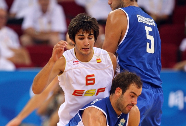 BEIJING - AUGUST 10:  Vasileios Spanoulis #7 of Greece moving around screen set by Ioannis Bourousis #5 of Greece while under pressure from Ricky Rubio #6 of Spain during the day 2 preliminary game at the Beijing 2008 Olympic Games in the Beijing Olympic Basketball Gymnasium on August 10, 2008 in Beijing, China.  (Photo by Phil Walter/Getty Images)