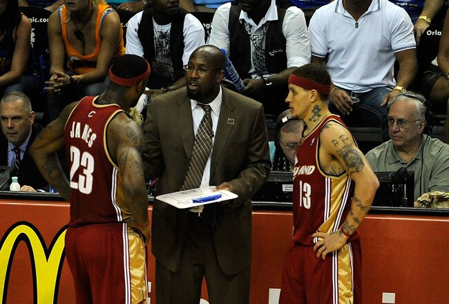 ORLANDO, FL - MAY 24:  Mike Brown, Head Coach of the Cleveland Cavaliers, talks with players LeBron James #23 and Delonte West #13 during the game against the Orlando Magic in Game Three of the Eastern Conference Finals during the 2009 NBA Playoffs at the the Amway Arena on May 24, 2009 in Orlando, Florida. NOTE TO USER: User expressly acknowledges and agrees that, by downloading and or using this photograph, User is consenting to the terms and conditions of the Getty Images License Agreement.  (Photo by Sam Greenwood/Getty Images)