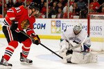 CHICAGO - MAY 09: Roberto Luongo #1 of the Vancouver Canucks stops a shot by Marian Hossa #81 of the Chicago Blackhawks closes in in Game Five of the Western Conference Semifinals during the 2010 NHL Stanley Cup Playoffs at United Center on May 9, 2010 in Chicago, Illinois. (Photo by Jonathan Daniel/Getty Images)