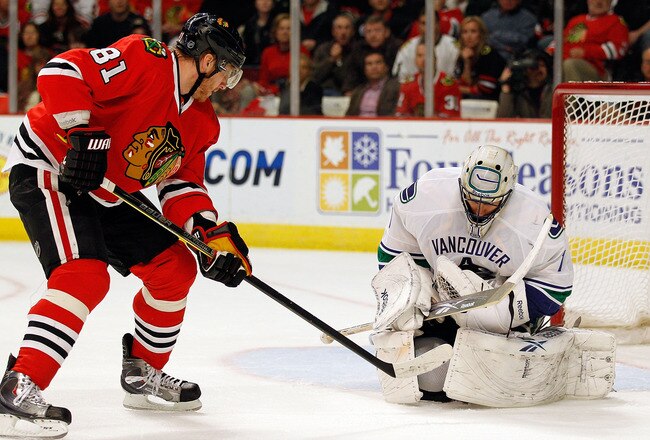 CHICAGO - MAY 09: Roberto Luongo #1 of the Vancouver Canucks stops a shot by Marian Hossa #81 of the Chicago Blackhawks closes in in Game Five of the Western Conference Semifinals during the 2010 NHL Stanley Cup Playoffs at United Center on May 9, 2010 in Chicago, Illinois. (Photo by Jonathan Daniel/Getty Images)