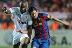 SEVILLE, SPAIN - MAY 08:  Lionel Messi (R) of Barcelona is tackled by Didier Zokora of Sevilla during the La Liga match between Sevilla and Barcelona at Estadio Ramon Sanchez Pizjuan on May 8, 2010 in Seville, Spain.  (Photo by Denis Doyle/Getty Images)