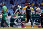 GROS ISLET, SAINT LUCIA - MAY 10: Kamran Akmal of Pakistan celebrates the wicket of Johan Botha during the ICC World Twenty20 Super Eight match between Pakistan and South Africa played at the Beausejour Cricket Ground on May 10, 2010 in Gros Islet, Saint Lucia.  (Photo by Julian Herbert/Getty Images)