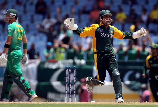GROS ISLET, SAINT LUCIA - MAY 10: Kamran Akmal of Pakistan celebrates the wicket of Johan Botha during the ICC World Twenty20 Super Eight match between Pakistan and South Africa played at the Beausejour Cricket Ground on May 10, 2010 in Gros Islet, Saint Lucia.  (Photo by Julian Herbert/Getty Images)
