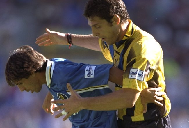 27 Jul 1997:  Gianfranco Zola of Chelsea is held up by Slaven Bilic of Everton during the Umbro Cup match at Goodison Park in Liverpool, England. \ Mandatory Credit: Ben Radford /Allsport