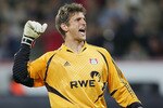 LEVERKUSEN, GERMANY - SEPTEMBER 15:  Jorg Butt of Leverkusen celebrates the third goal during The UEFA Champions League match between Bayer Leverkusen and Real Madrid at The Bayer Arena on September 15, 2004 in Leverkusen, Germany.  (Photo by Stuart Franklin/Getty Images)