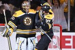 BOSTON - APRIL 26:  Tuukka Rask #40 and Patrice Bergeron #37 of the Boston Bruins celebrate the win over the Buffalo Sabres in Game Six of the Eastern Conference Quarterfinals during the 2010 NHL Stanley Cup Playoffs at TD Garden on April 26, 2010 in Boston, Massachusetts. The Bruins defeated the Sabres 4-3 to win the series.  (Photo by Elsa/Getty Images)