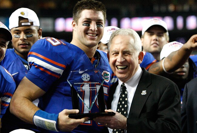ATLANTA - DECEMBER 06:  Quarterback Tim Tebow #15 of the Florida Gators receives the Most Valuable Player award from SEC Commissioner Mike Slive after the Gators 31-20 win over the Alabama Crimson Tide in the SEC Championship on December 6, 2008 at the Georgia Dome in Atlanta, Georgia.  (Photo by Kevin C. Cox/Getty Images)