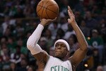 BOSTON - MAY 09:  Rajon Rondo #9 of the Boston Celtics takes a shot in the first half against the Cleveland Cavaliers during Game Four of the Eastern Conference Semifinals of the 2010 NBA playoffs at TD Garden on May 9, 2010 in Boston, Massachusetts  NOTE TO USER: User Expressly Acknowledges and agrees that, by downloading and or using this photograph, User is consenting to the terms and conditions of the Getty Images License Agreement.  (Photo by Elsa/Getty Images)