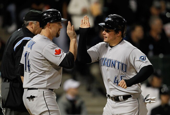 CHICAGO - MAY 06: Travis Snider #45 of the Toronto Blue Jays is congratulated by teammate John Buck #14 after scoiring a run in the 5th inning against the Chicago White Sox at U.S. Cellular Field on May 6, 2010 in Chicago, Illinois. (Photo by Jonathan Daniel/Getty Images)