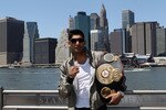 NEW YORK - MAY 10:  British boxer Amir Khan poses with the WBA World light welterweight championship belt by the Brooklyn Bridge on May 10, 2010 in the Brooklyn borough of New York City.  (Photo by John Gichigi/Getty Images)