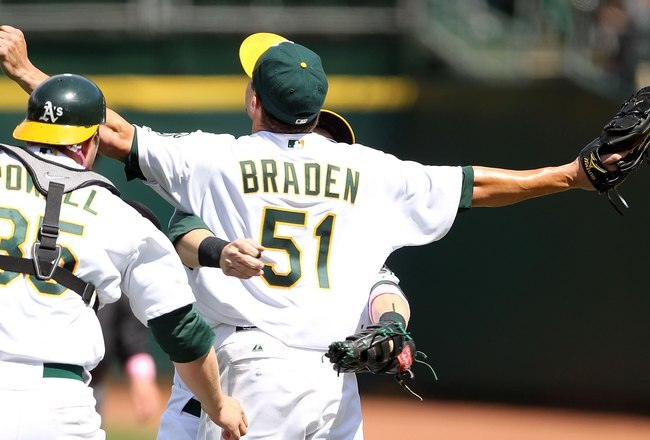 OAKLAND, CA - MAY 09:  Dallas Braden #51 of the Oakland Athletics celebrates after pitching a perfect game against the Tampa Bay Rays during an MLB game at the Oakland-Alameda County Coliseum on May 9, 2010 in Oakland, California.  (Photo by Jed Jacobsohn/Getty Images)