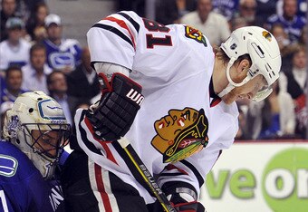 VANCOUVER, CANADA - MAY 11: Goalie Roberto Luongo #1 of the Vancouver Canucks makes a save with Marian Hossa #81 of the Chicago Blackhawks in close during the second period in Game Six of the Western Conference Semifinals during the 2010 NHL Stanley Cup Playoffs on May 11, 2010 at General Motors Place in Vancouver, British Columbia, Canada. (Photo by Rich Lam/Getty Images)