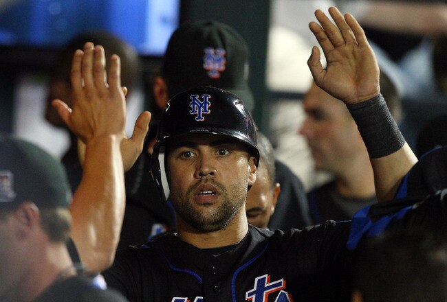NEW YORK - JUNE 19:  Carlos Beltran #15 of the New York Mets celebrates in the dugout after scoring in the eigth inning against the Tampa Bay Rays on June 19, 2009 at Citi Field in the Flushing neighborhood of the Queens borough of New York City.  (Photo by Jim McIsaac/Getty Images)
