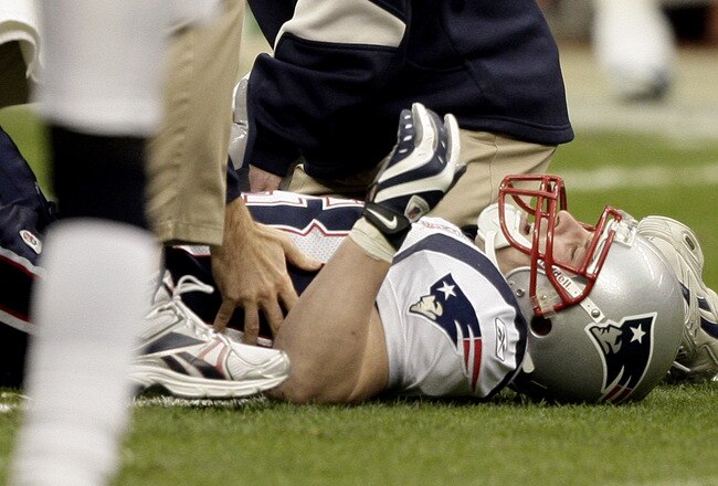 HOUSTON - JANUARY 03:  Wide receiver Wes Welker #83 of the New England Patriots is tended to by medical personnel after injuring his leg against the Houston Texans at Reliant Stadium on January 3, 2010 in Houston, Texas.  (Photo by Bob Levey/Getty Images)