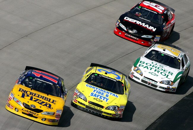 DOVER, DE - MAY 30:  Scott Legasse Jr., driver of the #11 America's Incredible Pizza Company Chevrolet, races a group of cars during the NASCAR Nationwide Series Heluva Good! 200 at Dover International Speedway on May 30, 2009 in Dover, Delaware.  (Photo by Todd Warshaw/Getty Images)