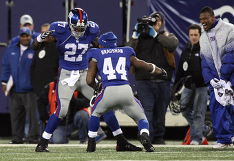 EAST RUTHERFORD, NJ - DECEMBER 06:  Brandon Jacobs #27 and Ahmad Bradshaw #44 of the New York Giants celebrate after Jacobs scored a 74 yard touchdown reception in the third quarter against the Dallas Cowboys at Giants Stadium on December 6, 2009 in East Rutherford, New Jersey.  (Photo by Jim McIsaac/Getty Images)
