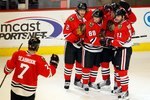 CHICAGO - MAY 03: (L-R) Brent Seabrook #7, Duncan Keith #2, Patrick Kane #88, Jonathan Toews #19 and John Madden #11 of the Chicago Blackhawks celebrate a goal against the Vancouver Canucks in Game Two of the Western Conference Semifinals during the 2010 NHL Stanley Cup Playoffs at United Center on May 3, 2010 in Chicago, Illinois. The Blackhawks defeated the Canucks 4-2. (Photo by Jonathan Daniel/Getty Images)