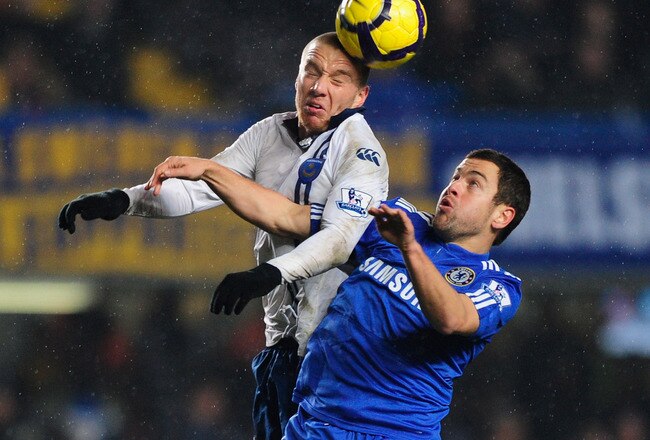 LONDON, ENGLAND - DECEMBER 16:  Joe Cole of Chelsea jumps with Jamie O'Hara of Portsmouth during the Barclays Premier League match between Chelsea and Portsmouth at Stamford Bridge on December 16, 2009 in London, England.  (Photo by Jamie McDonald/Getty Images)