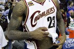 CLEVELAND - MAY 11:  LeBron James #23 of the Cleveland Cavaliers untucks his jersey after being defeated 120-88 by the Boston Celtics in Game Five of the Eastern Conference Semifinals during the 2010 NBA Playoffs at Quicken Loans Arena on May 11, 2010 in Cleveland, Ohio.  NOTE TO USER: User expressly acknowledges and agrees that, by downloading and or using this photograph, User is consenting to the terms and conditions of the Getty Images License Agreement.  (Photo by Gregory Shamus/Getty Images)