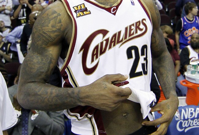 CLEVELAND - MAY 11:  LeBron James #23 of the Cleveland Cavaliers untucks his jersey after being defeated 120-88 by the Boston Celtics in Game Five of the Eastern Conference Semifinals during the 2010 NBA Playoffs at Quicken Loans Arena on May 11, 2010 in Cleveland, Ohio.  NOTE TO USER: User expressly acknowledges and agrees that, by downloading and or using this photograph, User is consenting to the terms and conditions of the Getty Images License Agreement.  (Photo by Gregory Shamus/Getty Images)