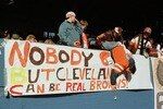 17 DEC 1995:  BROWNS FAN KENNY TAYLOR IS HELD BY HIS FATHER DWAYNE WHILE HE POSTS A BANNER BEFORE THE CLEVELAND V CINCINNATI GAME AT CLEVELAND STADIUM IN CLEVELAND, OHIO. THIS WAS THE BROWNS'' LAST GAME AT CLEVELAND SINCE OWNER ART MODELL IS MOVING THE TEA
