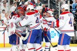 PITTSBURGH - MAY 12:  Jaroslav Halak #41 of the Montreal Canadiens is congratulated by teammates after defeating the Pittsburgh Penguins in Game Seven of the Eastern Conference Semifinals during the 2010 Stanley Cup Playoffs at Mellon Arena on May 12, 2010 in Pittsburgh, Pennsylvania. The Canadiens defeated the Penguins 5-2 to win the series 4-3 and advance to the Conference Finals.  (Photo by Dave Sandford/Getty Images)