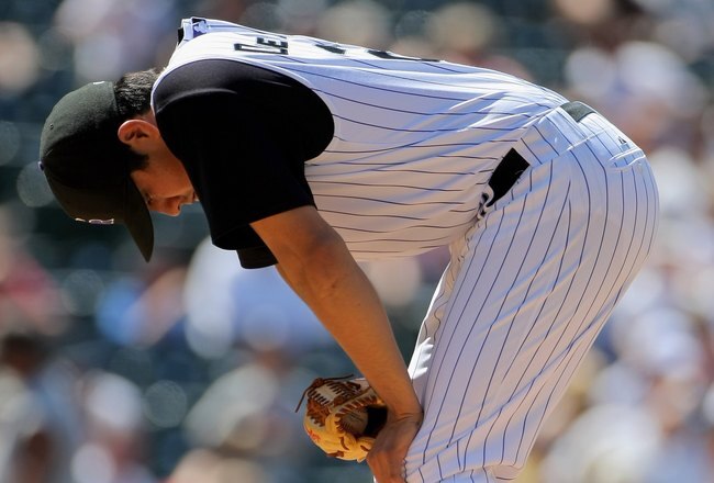 DENVER - JULY 08:  Starting pitcher Jorge De La Rosa #29 ofthe Colorado Rockies pauses before he leaves the mound and exits the game in the seventh inning against the Washington Nationals during MLB action at Coors Field on July 8, 2009 in Denver, Colorado. De La Rosa pitched 6 1/3 innings and earned he win as the Rockies defeated the Nationals 10-4.  (Photo by Doug Pensinger/Getty Images)