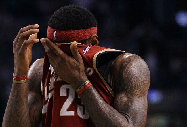 BOSTON - MAY 13:  LeBron James #23 of the Cleveland Cavaliers wipes the sweat from his face in the fourth quarter against the Boston Celtics during Game Six of the Eastern Conference Semifinals of the 2010 NBA playoffs at TD Garden on May 13, 2010 in Boston, Massachusetts. The Celtics defeated the Cavaliers 94-85.  NOTE TO USER: User Expressly Acknowledges and agrees that, by downloading and or using this photograph, User is consenting to the terms and conditions of the Getty Images License Agreement.  (Photo by Elsa/Getty Images)