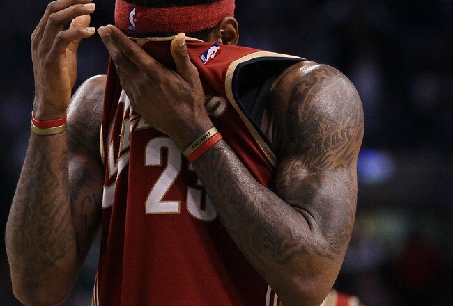 BOSTON - MAY 13:  LeBron James #23 of the Cleveland Cavaliers wipes the sweat from his face in the fourth quarter against the Boston Celtics during Game Six of the Eastern Conference Semifinals of the 2010 NBA playoffs at TD Garden on May 13, 2010 in Boston, Massachusetts. The Celtics defeated the Cavaliers 94-85.  NOTE TO USER: User Expressly Acknowledges and agrees that, by downloading and or using this photograph, User is consenting to the terms and conditions of the Getty Images License Agreement.  (Photo by Elsa/Getty Images)