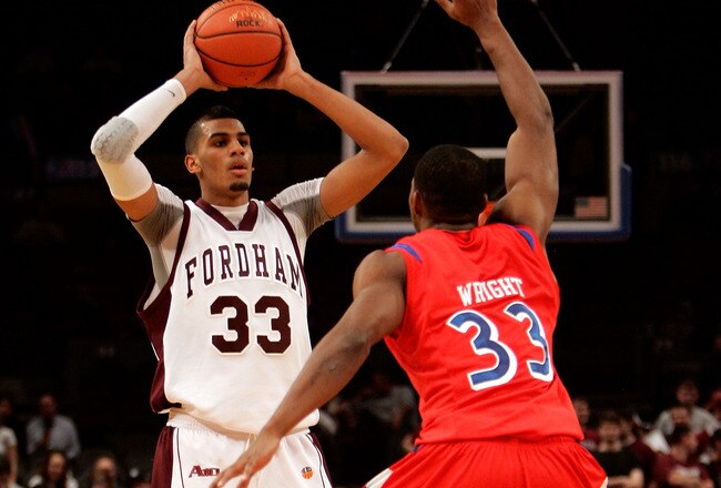 NEW YORK - JANUARY 13: Chris Gaston #33 of the Fordham Rams looks to pass against Chris Wright #33 of the Dayton Flyers at Madison Square Garden on January 13, 2010 in New York, New York.  (Photo by Mike Lawrie/Getty Images)