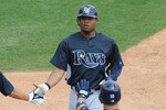 DUNEDIN, FL - MARCH 26: Outfielder Carl Crawford #13 of the  Tampa Bay Rays celebrates a run against the Toronto Blue Jays March 26, 2010 at Dunedin Stadium in Dunedin, Florida. (Photo by Al Messerschmidt/Getty Images)
