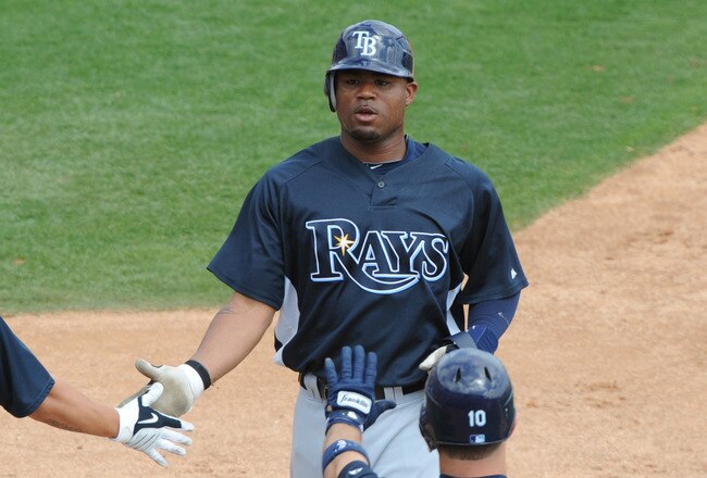 DUNEDIN, FL - MARCH 26: Outfielder Carl Crawford #13 of the  Tampa Bay Rays celebrates a run against the Toronto Blue Jays March 26, 2010 at Dunedin Stadium in Dunedin, Florida. (Photo by Al Messerschmidt/Getty Images)