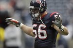 HOUSTON - DECEMBER 13:  Linebacker Brian Cushing #56 of the Houston Texans reacts against the Seattle Seahawks at Reliant Stadium on December 13, 2009 in Houston, Texas.  (Photo by Bob Levey/Getty Images)