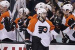 BOSTON - MAY 14:  Simon Gagne #12 of the Philadelphia Flyers is congratulated by teammates on the bench after he scored the game winning goal in the third period against the Boston Celtics in Game Seven of the Eastern Conference Semifinals during the 2010 NHL Stanley Cup Playoffs at TD Garden on May 14, 2010 in Boston, Massachusetts. The Flyers defeated the Bruins 4-3.  (Photo by Elsa/Getty Images)