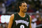 LOS ANGELES - MARCH 31:  Latrell Sprewell #8 of the Minnesota Timberwolves looks on during a break in action against the Los Angeles Lakers on March 31, 2005 at Staples Center in Los Angeles, California. NOTE TO USER: User expressly acknowledges and agrees that, by downloading and or using this photograph, User is consenting to the terms and conditions of the Getty Images License Agreement.  (Photo by Lisa Blumenfeld/Getty Images)