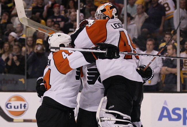 BOSTON - MAY 14:  Kimmo Timonen #44 and Mike Richards #18 of the Philadelphia Flyers celebrates the win with goalie Michael Leighton #49 after defeated the Boston Bruins in Game Seven of the Eastern Conference Semifinals during the 2010 NHL Stanley Cup Playoffs at TD Garden on May 14, 2010 in Boston, Massachusetts. The Flyers defeated the Bruins 4-3.  (Photo by Elsa/Getty Images)