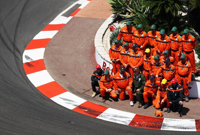 MONTE CARLO, MONACO - MAY 16:  Marshalls line up for a group photo before the Monaco Formula One Grand Prix at the Monte Carlo Circuit on May 16, 2010 in Monte Carlo, Monaco.  (Photo by Paul Gilham/Getty Images)
