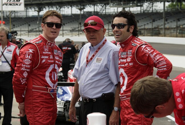 INDIANAPOLIS - MAY 15: Scott Dixon (L) and Dario Franchitti of Chip Ganassi Racing chat with a crew member during opening day at the Indianapolis Motor Speedway on May 15, 2010 in Indianapolis, Indiana.   (Photo by Ron Hoskins/Getty Images)