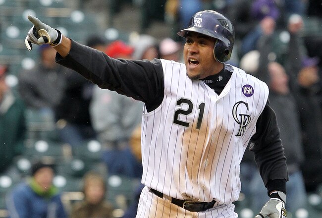 DENVER - MAY 12:  Catcher Miguel Olivo #21 of the Colorado Rockies celebrates as he rounds the bases on his game winning solo homerun off of Chad Durbin of the Philadelphia Phillies in the 10th inning at Coors Field on May 12, 2010 in Denver, Colorado. The Rockies defeated the Phillies 4-3 in 10 innings.  (Photo by Doug Pensinger/Getty Images)