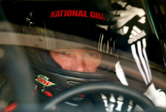 DOVER, DE - MAY 15:  Dale Earnhardt Jr., driver of the #88 AMP Energy/National Guard Chevrolet, puts his driving gloves on in the garage prior to practice for the NASCAR Sprint Cup Series Autism Speaks 400 at Dover International Speedway on May 15, 2010 in Dover, Delaware.  (Photo by Geoff Burke/Getty Images for NASCAR)