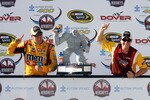 DOVER, DE - MAY 16:  Kyle Busch (L), driver of the #18 M&M's Toyota, and crew chief Dave Rogers poses in Victory Lane after winning the NASCAR Sprint Cup Series Autism Speaks 400 at Dover International Speedway on May 16, 2010 in Dover, Delaware.  (Photo by Jason Smith/Getty Images for NASCAR)