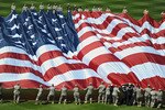 PHILADELPHIA - APRIL 12: Members of the United States military bring out the American Flag before the game between the Washington Nationals and Philadelphia Phillies on Opening Day at Citizens Bank Park on April 12, 2010 in Philadelphia, Pennsylvania. (Photo by Drew Hallowell/Getty Images)