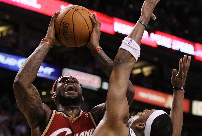 BOSTON - MAY 13:  LeBron James #23 of the Cleveland Cavaliers tries to take a shot over Paul Pierce #34 of the Boston Celtics during Game Six of the Eastern Conference Semifinals of the 2010 NBA playoffs at TD Garden on May 13, 2010 in Boston, Massachusetts. The Celtics defeated the Cavaliers 94-85.  NOTE TO USER: User Expressly Acknowledges and agrees that, by downloading and or using this photograph, User is consenting to the terms and conditions of the Getty Images License Agreement.  (Photo by Elsa/Getty Images)