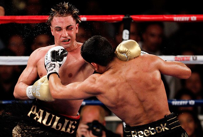 NEW YORK - MAY 15:  Amir Khan (R) of Great Britain hits Paulie Malignaggi during the WBA light welterweight title fight at Madison Square Garden on May 15, 2010 in New York City.  (Photo by Chris Trotman/Getty Images)