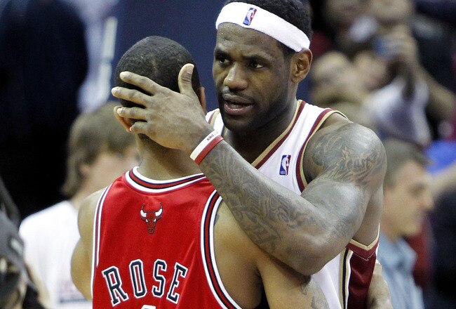 CLEVELAND - APRIL 27:  LeBron James #23 of the Cleveland Cavaliers talks with Derrick Rose #1 of the Chicago Bulls after defeating the Bulls 96-94 in Game Five of the Eastern Conference Quarterfinals during the 2010 NBA Playoffs at Quicken Loans Arena on April 27, 2010 in Cleveland, Ohio. Cleveland won the series 4-1. NOTE TO USER: User expressly acknowledges and agrees that, by downloading and or using this photograph, User is consenting to the terms and conditions of the Getty Images License Agreement.  (Photo by Gregory Shamus/Getty Images)