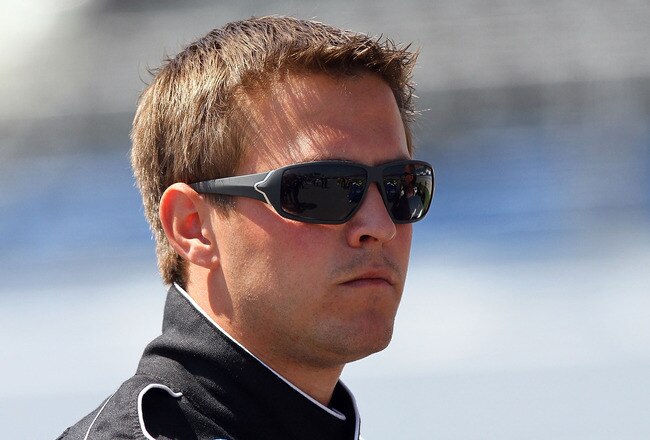 TALLADEGA, AL - APRIL 23:  Steve Arpin, driver of the #7 JR Motorsports Chevrolet, stands on the grid during qualifying for the NASCAR Nationwide Series Aaron's 312 at Talladega Superspeedway on April 23, 2010 in Talladega, Alabama.  (Photo by Jason Smith/Getty Images)